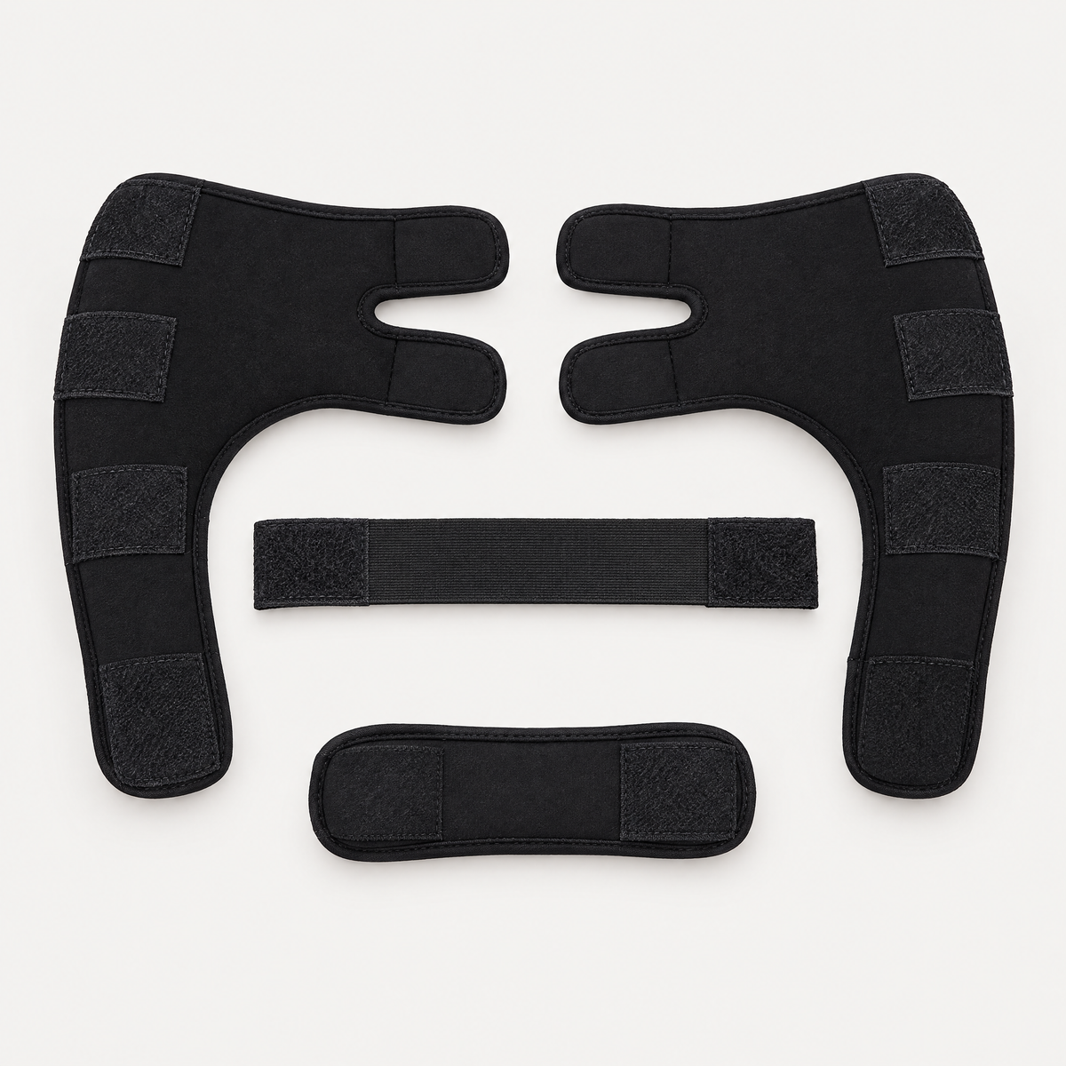 Diloxa front leg support set laid flat: two black padded neoprene leg sleeves with chest and back straps